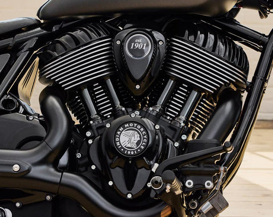 Close-up of a black Indian Motorcycle V-Range engine with chrome accents and the brand logo visible on the cover.