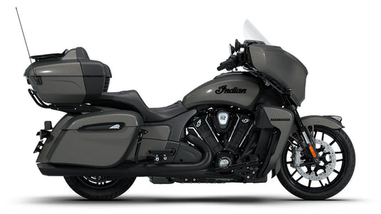 A side profile view of a 2026 Indian Roadmaster Dark Horse touring bike in matte dark gray, featuring a large windshield, saddlebags, a top case, and a windshield wiper, set against a plain white background.